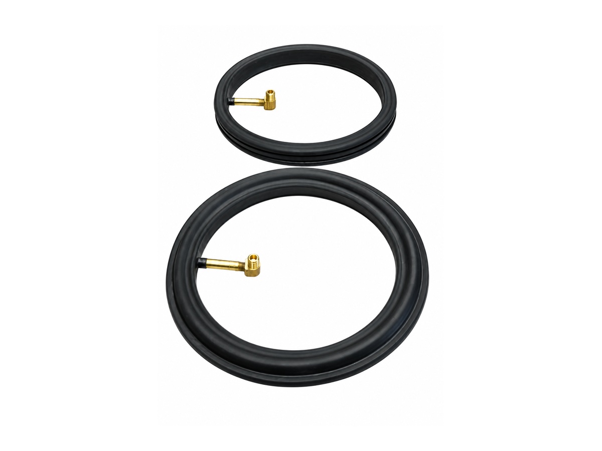 Two black circular seals with brass air fittings — Bulk Solids Feeder Inflatable Seal