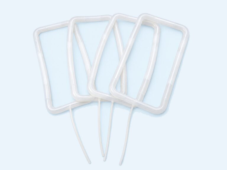Four translucent rectangular seals with attached tubes — Custom Inflatable Seals