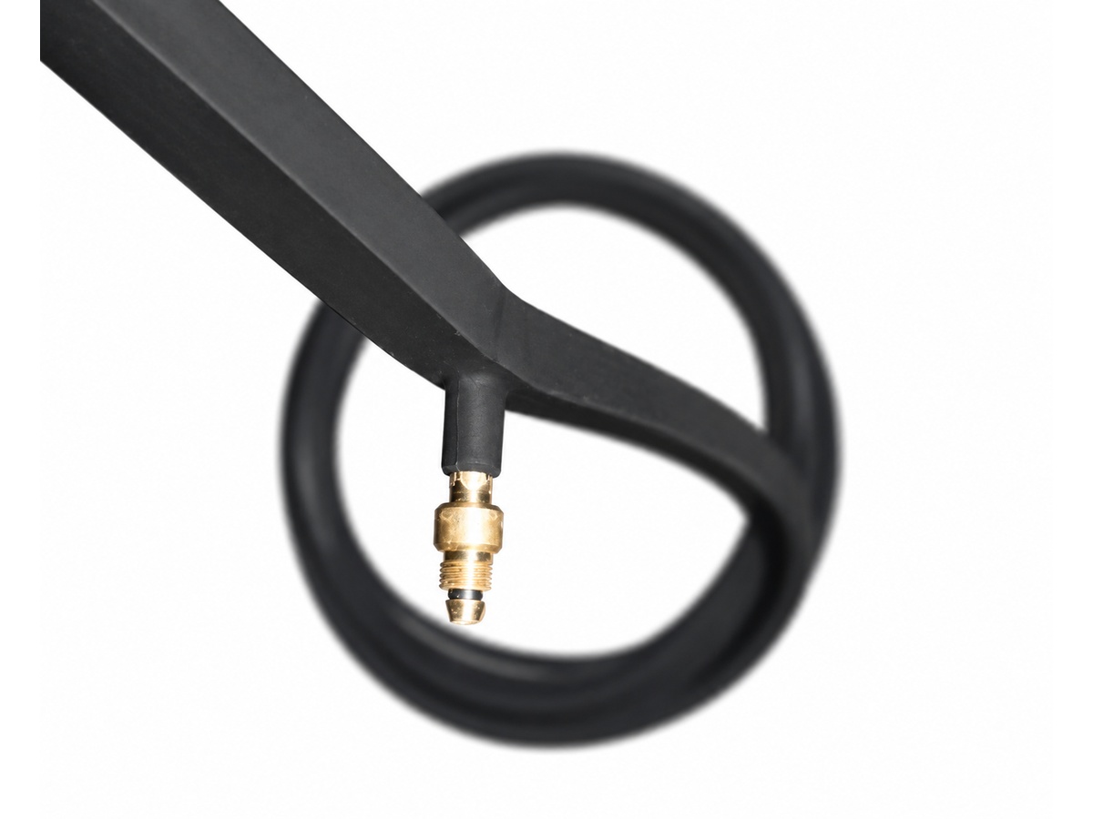 Close-up of black sealing profile with brass air fitting — Hydroelectric Power Generation Station / Plant Inflatable Seal